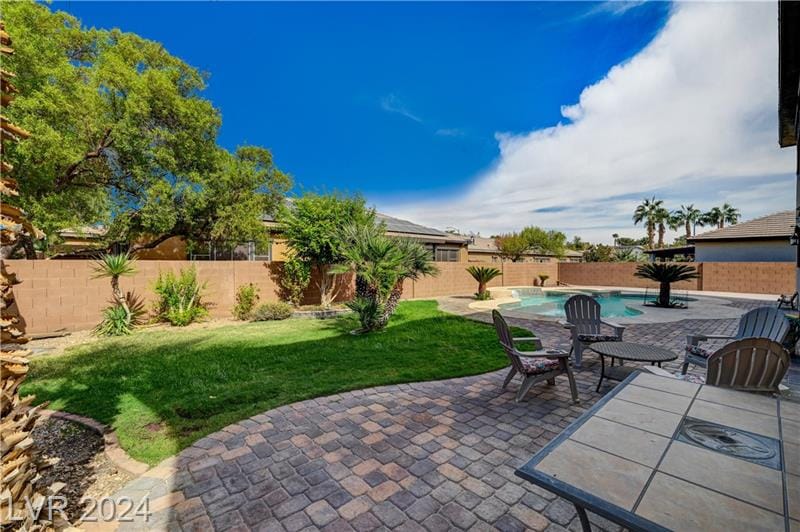 Backyard pool and paver patio of a home sold by Park Place Realty, Las Vegas